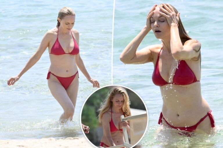 Heather Graham rocks purple bikini on the seaside in Italy