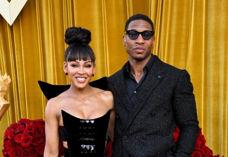 Meagan Good & Jonathan Majors Present Out With Crimson Carpet PDA