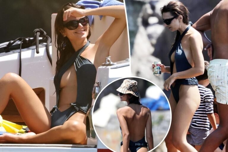 Emily Ratajkowski fashions cheeky cutout swimsuit on a ship in Italy