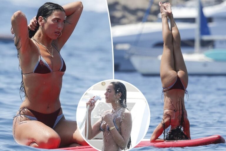 Dua Lipa flaunts her abs throughout paddleboard yoga in Ibiza