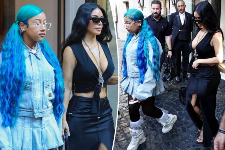 North West matches her blue hair to her denim set in Rome with Kim Kardashian North West matches her blue hair to her denim set in Rome with Kim Kardashian